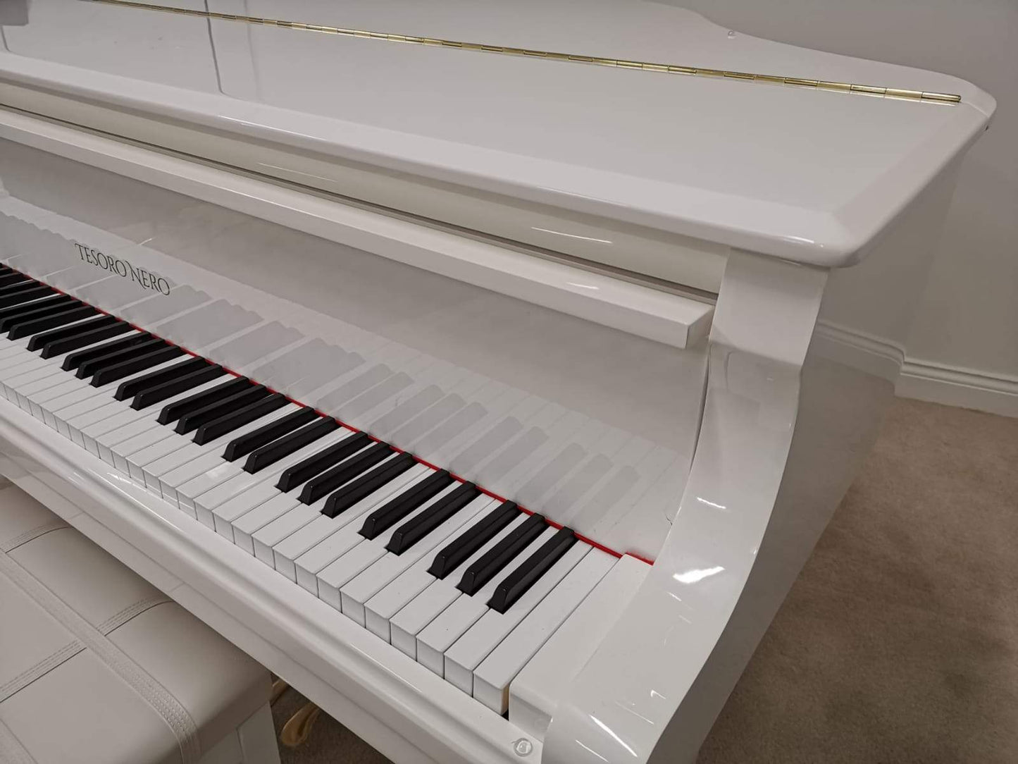 Refurbished Acoustic White Baby Grand Piano.